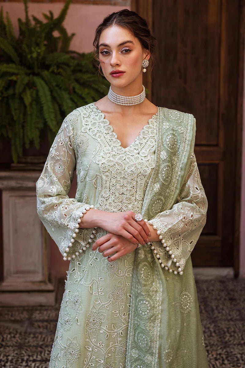 Model wearing mint green DHARA dress from Mushq, Saugaat Chickenkari Pret collection. Pakistani designer clothes in UK, readymade clothes, elegant and stylish.