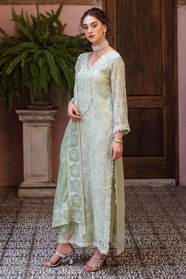 Model wearing mint green DHARA dress from Mushq, Saugaat Chickenkari Pret collection. Pakistani designer clothes in UK, readymade clothes, elegant and stylish.