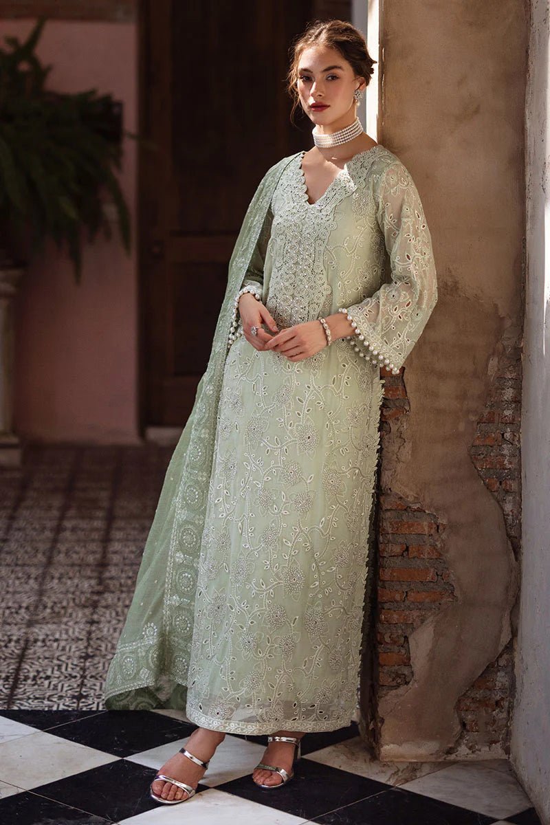 Model wearing mint green DHARA dress from Mushq, Saugaat Chickenkari Pret collection. Pakistani designer clothes in UK, readymade clothes, elegant and stylish.