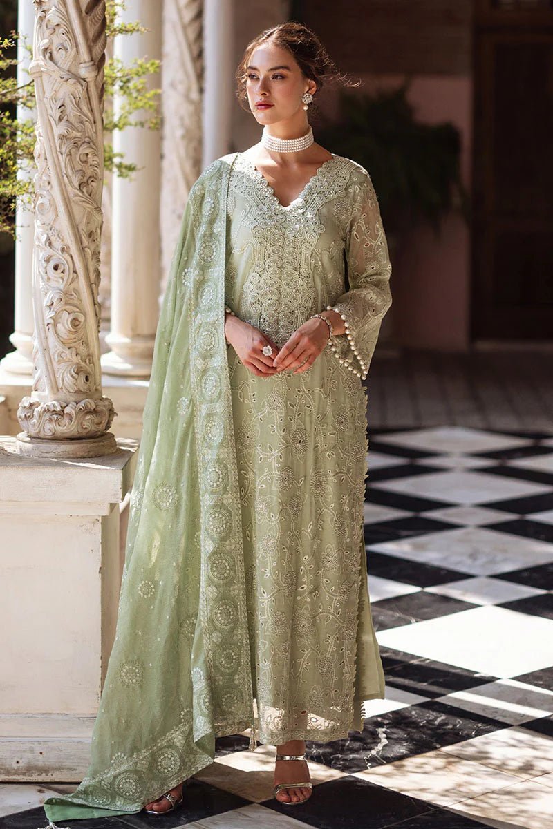 Model wearing mint green DHARA dress from Mushq, Saugaat Chickenkari Pret collection. Pakistani designer clothes in UK, readymade clothes, elegant and stylish.