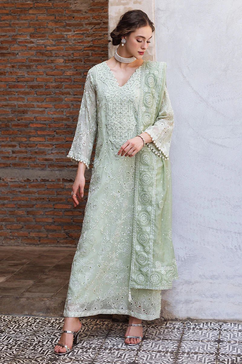 Model wearing mint green DHARA dress from Mushq, Saugaat Chickenkari Pret collection. Pakistani designer clothes in UK, readymade clothes, elegant and stylish.