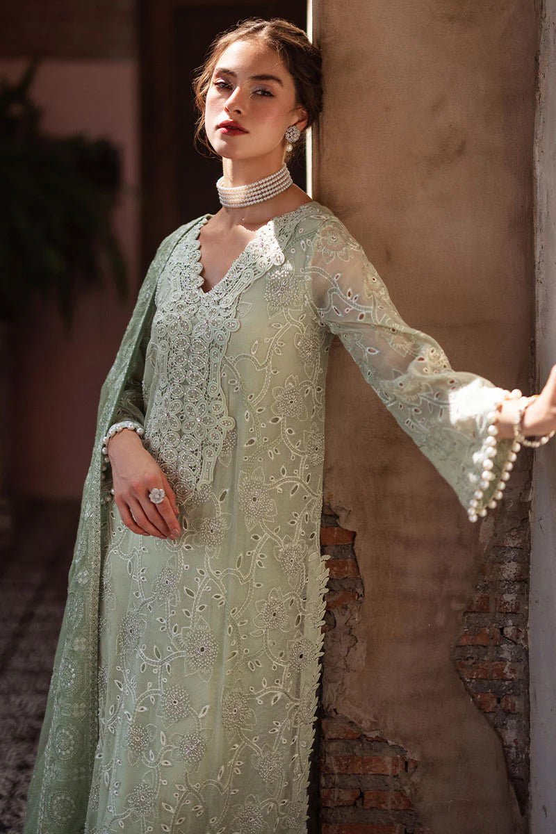 Model wearing mint green DHARA dress from Mushq, Saugaat Chickenkari Pret collection. Pakistani designer clothes in UK, readymade clothes, elegant and stylish.