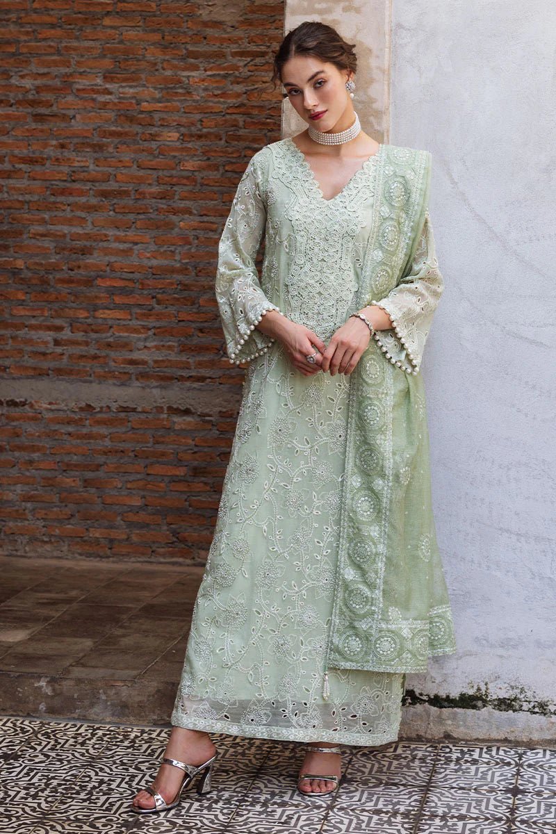 Model wearing mint green DHARA dress from Mushq, Saugaat Chickenkari Pret collection. Pakistani designer clothes in UK, readymade clothes, elegant and stylish.