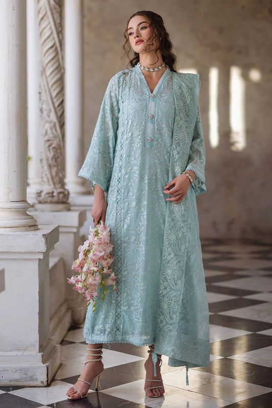 Model wearing light blue Fizza dress from Mushq, Saugaat Chickenkari Pret collection. Pakistani designer clothes in UK, readymade clothes, elegant and stylish.