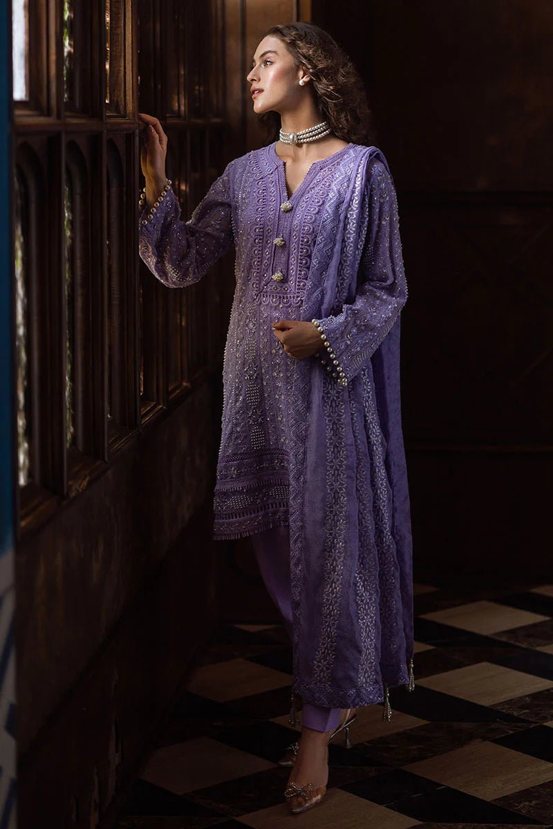 Model wearing lavender LALEH dress from Mushq, Saugaat Chickenkari Pret collection. Pakistani designer clothes in UK, readymade clothes, elegant and stylish.