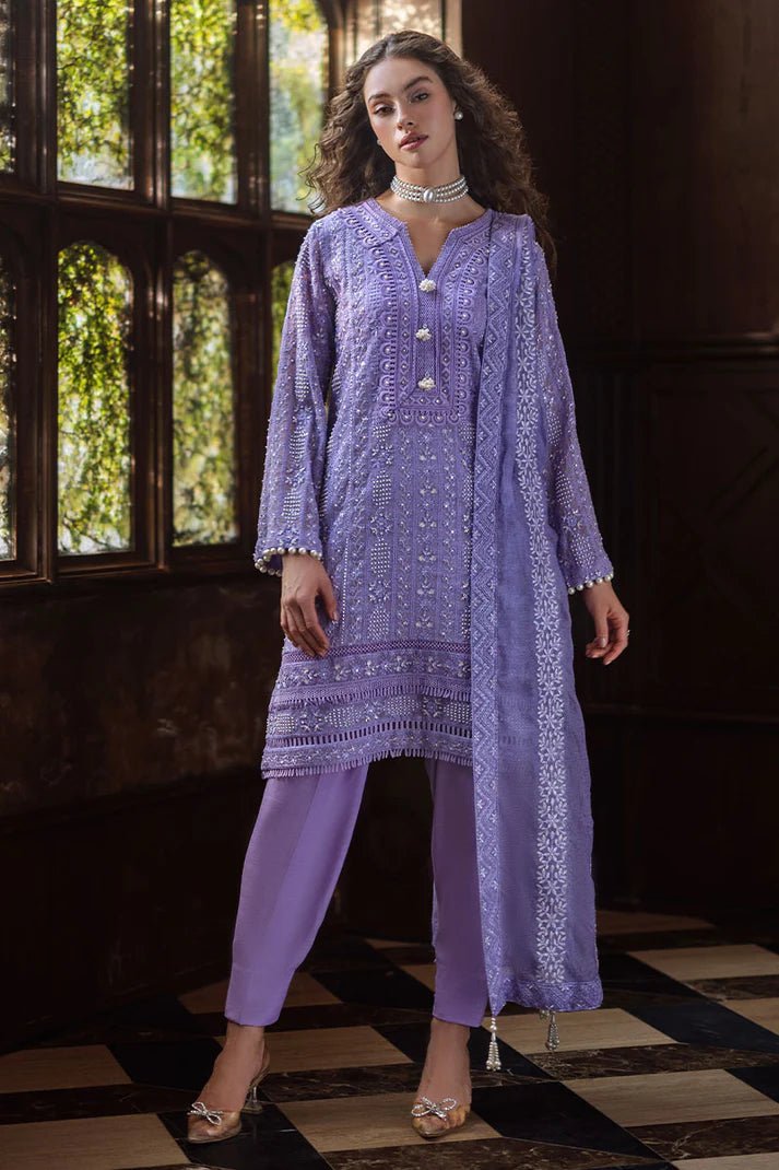 Model wearing lavender LALEH dress from Mushq, Saugaat Chickenkari Pret collection. Pakistani designer clothes in UK, readymade clothes, elegant and stylish.