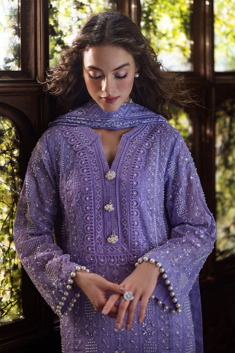 Model wearing lavender LALEH dress from Mushq, Saugaat Chickenkari Pret collection. Pakistani designer clothes in UK, readymade clothes, elegant and stylish.