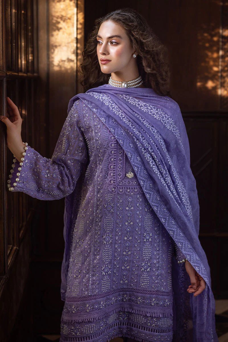 Model wearing lavender LALEH dress from Mushq, Saugaat Chickenkari Pret collection. Pakistani designer clothes in UK, readymade clothes, elegant and stylish.