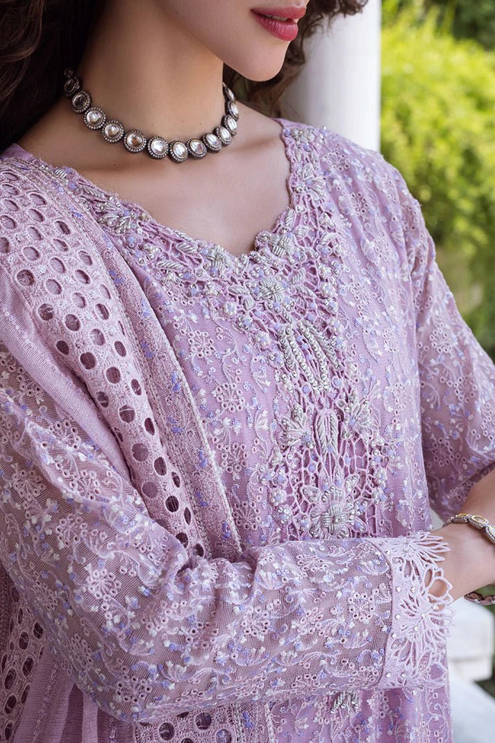 Model wearing a pastel pink Shirin dress from Mushq, Saugaat Chickenkari Pret collection. Pakistani designer clothes in UK, readymade clothes, elegant and stylish.