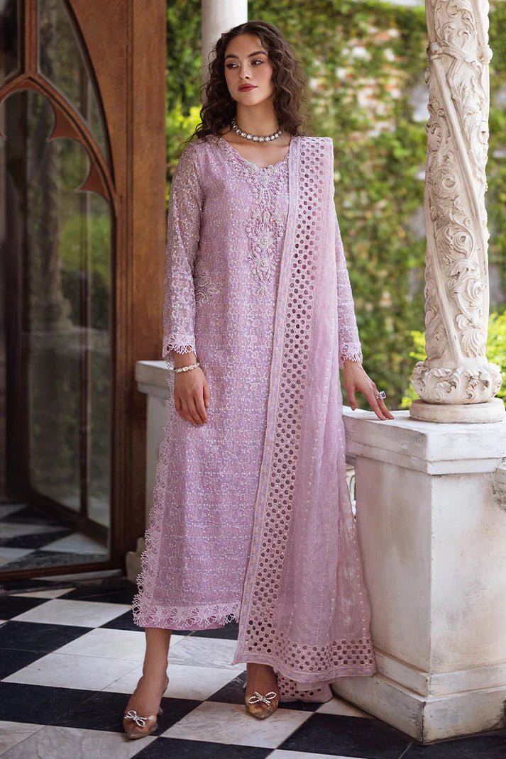 Model wearing a pastel pink Shirin dress from Mushq, Saugaat Chickenkari Pret collection. Pakistani designer clothes in UK, readymade clothes, elegant and stylish.