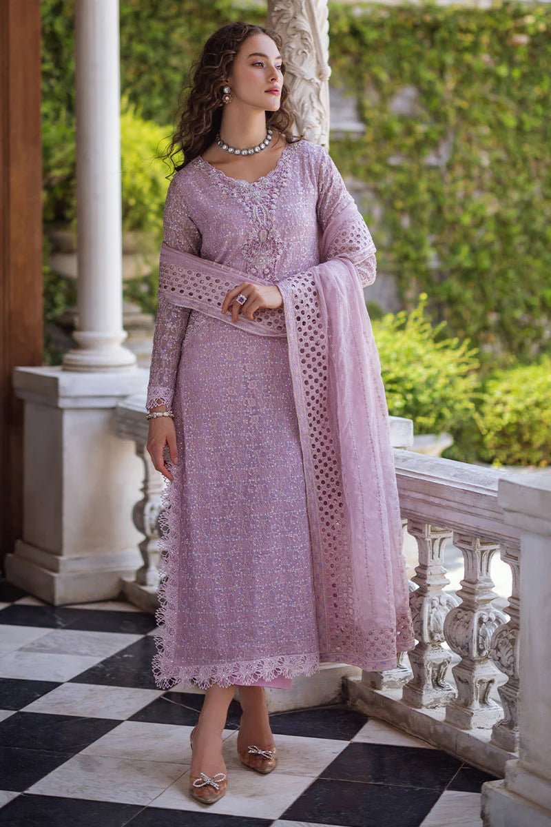 Model wearing a pastel pink Shirin dress from Mushq, Saugaat Chickenkari Pret collection. Pakistani designer clothes in UK, readymade clothes, elegant and stylish.