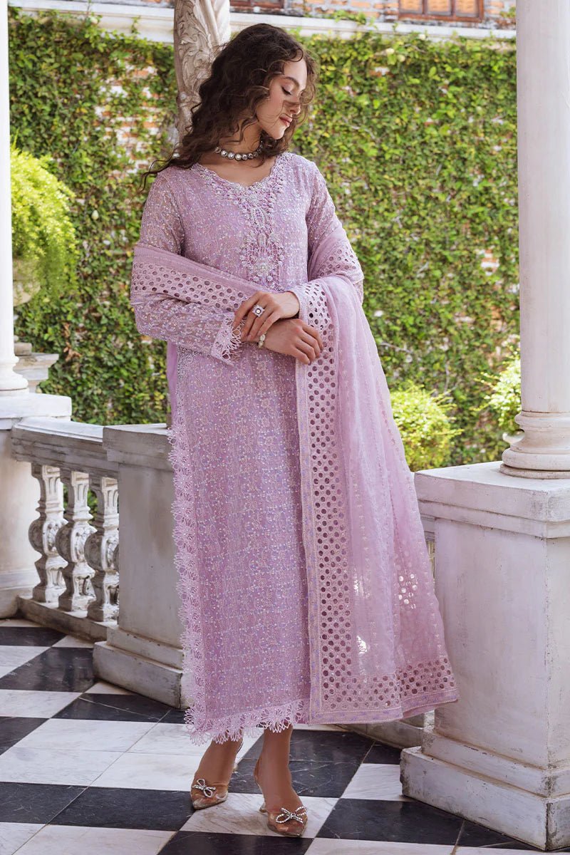 Model wearing a pastel pink Shirin dress from Mushq, Saugaat Chickenkari Pret collection. Pakistani designer clothes in UK, readymade clothes, elegant and stylish.