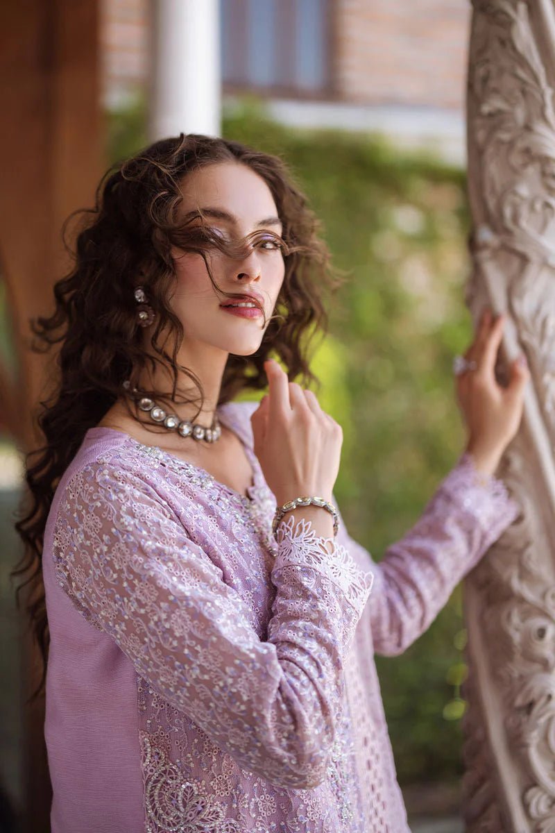 Model wearing a pastel pink Shirin dress from Mushq, Saugaat Chickenkari Pret collection. Pakistani designer clothes in UK, readymade clothes, elegant and stylish.