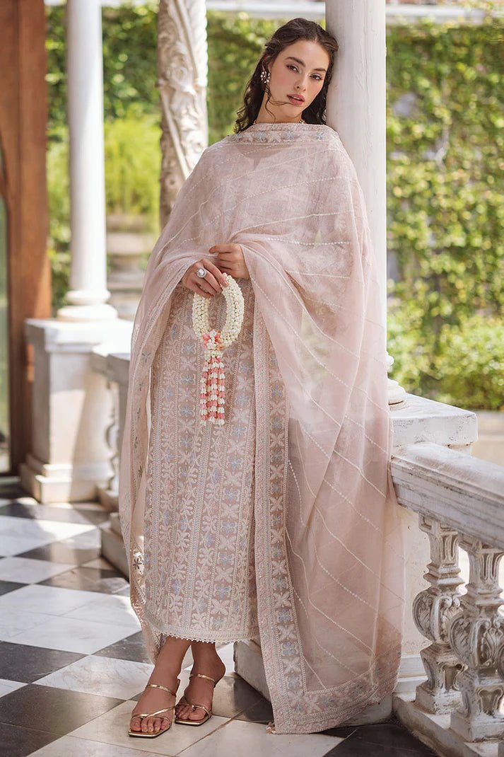 Model wearing a beige SWARA dress from Mushq, Saugaat Chickenkari Pret collection. Pakistani designer clothes in UK, readymade clothes, elegant and stylish.