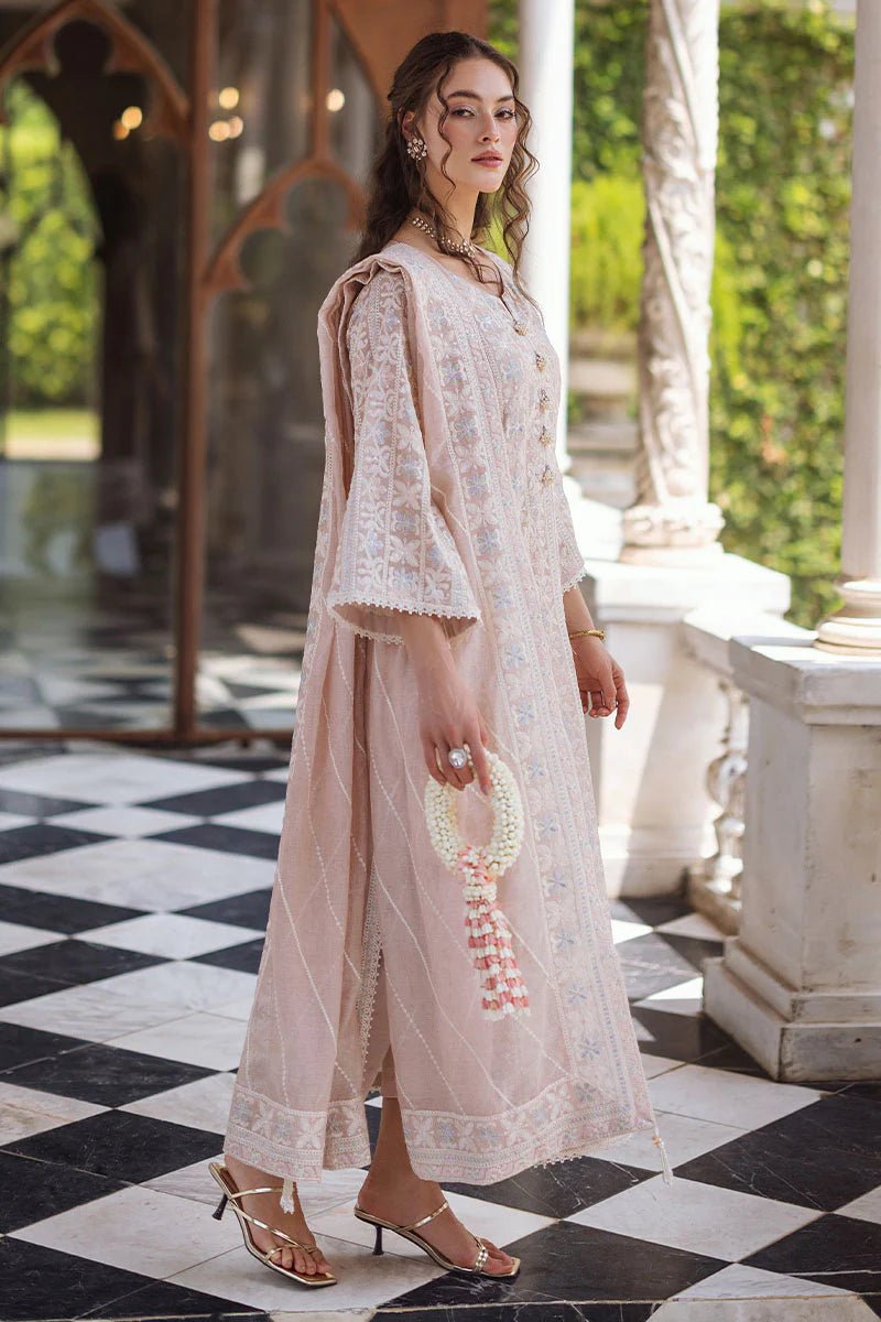 Model wearing a beige SWARA dress from Mushq, Saugaat Chickenkari Pret collection. Pakistani designer clothes in UK, readymade clothes, elegant and stylish.