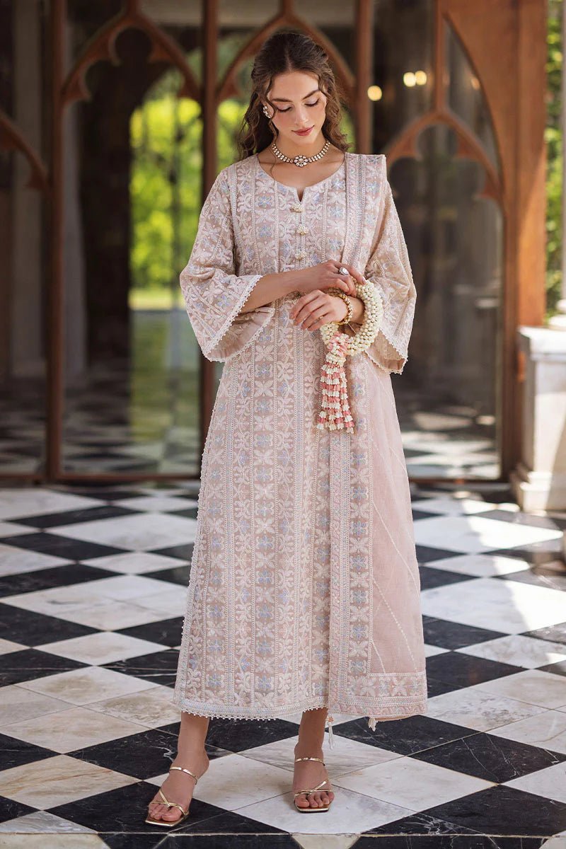 Model wearing a beige SWARA dress from Mushq, Saugaat Chickenkari Pret collection. Pakistani designer clothes in UK, readymade clothes, elegant and stylish.