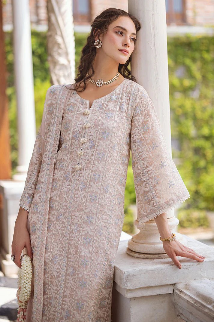 Model wearing Swara dress from Mushq's Saugaat Chickenkari Pret collection. Pakistani clothes online in the UK at Signature Labels.