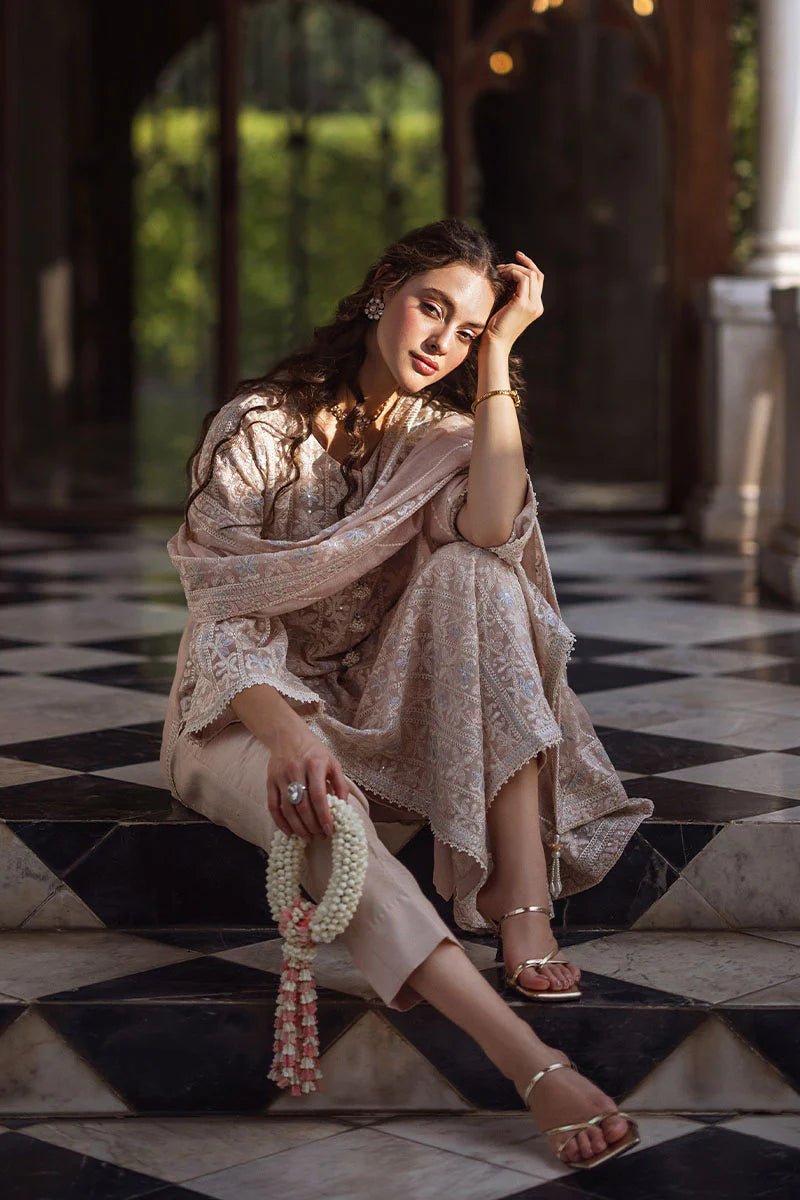 Model wearing Swara dress from Mushq's Saugaat Chickenkari Pret collection. Pakistani clothes online in the UK at Signature Labels.