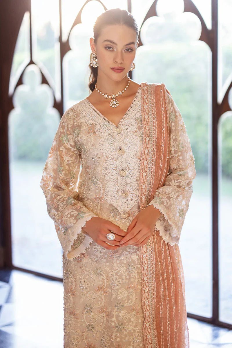 Model wearing a pastel pink and white ZIBA dress from Mushq, Saugaat Chickenkari Pret collection. Pakistani designer clothes in UK, readymade clothes, elegant and stylish.