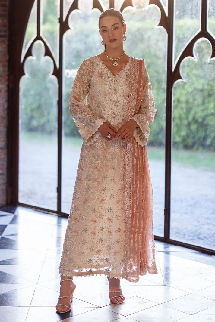 Model wearing a pastel pink and white ZIBA dress from Mushq, Saugaat Chickenkari Pret collection. Pakistani designer clothes in UK, readymade clothes, elegant and stylish.