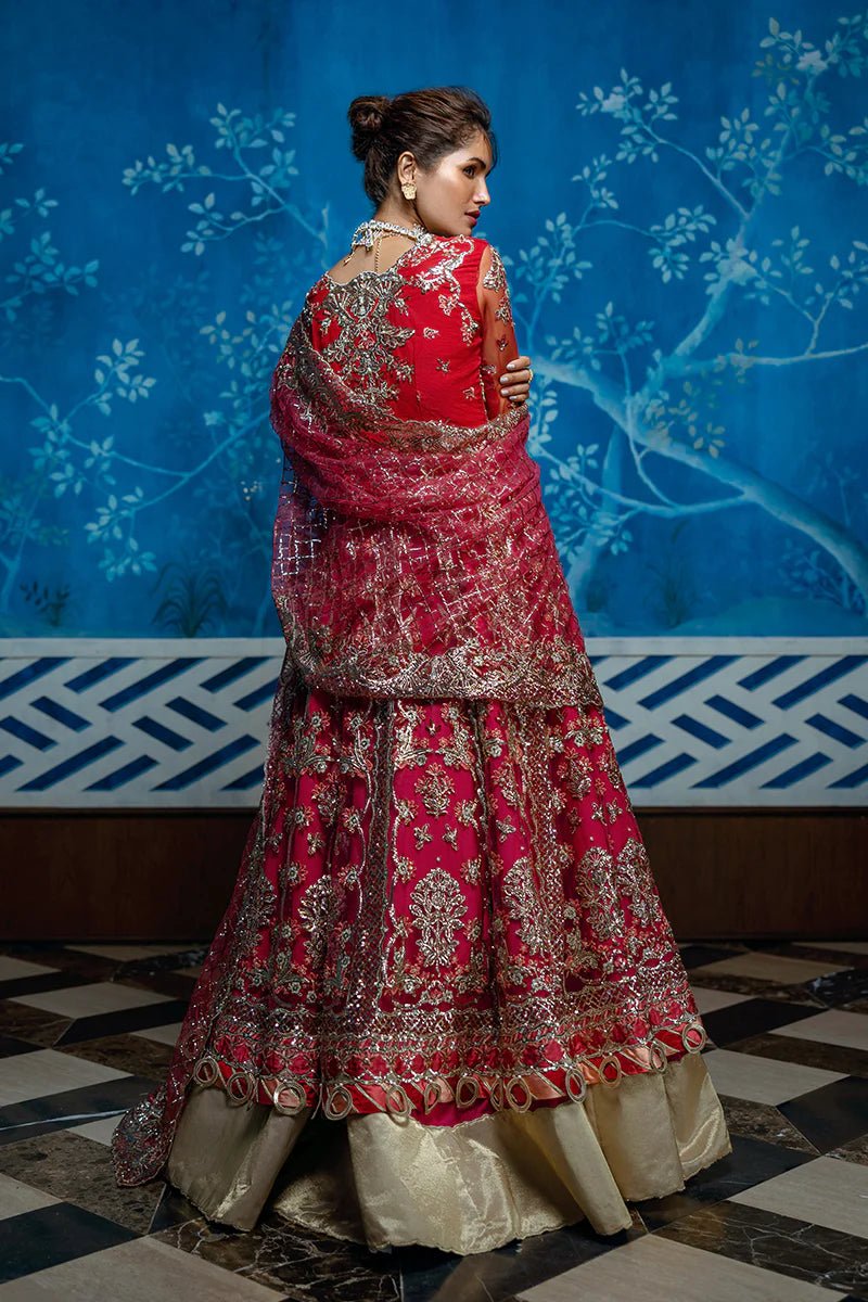 Model wearing Red Carpet from Mushq's Stardust Wedding Collection '24, featuring luxurious design and detailing. Pakistani clothes online in UK.