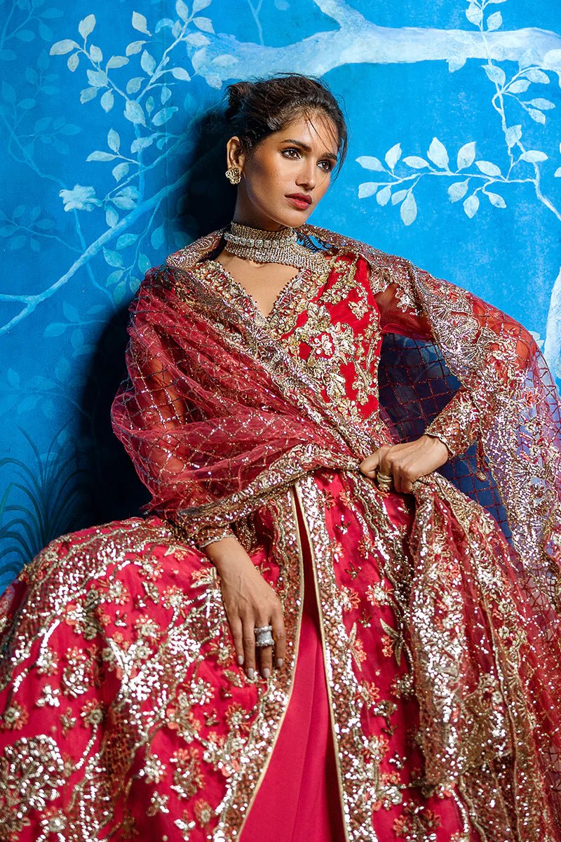 Model wearing Red Carpet from Mushq's Stardust Wedding Collection '24, featuring luxurious design and detailing. Pakistani clothes online in UK.