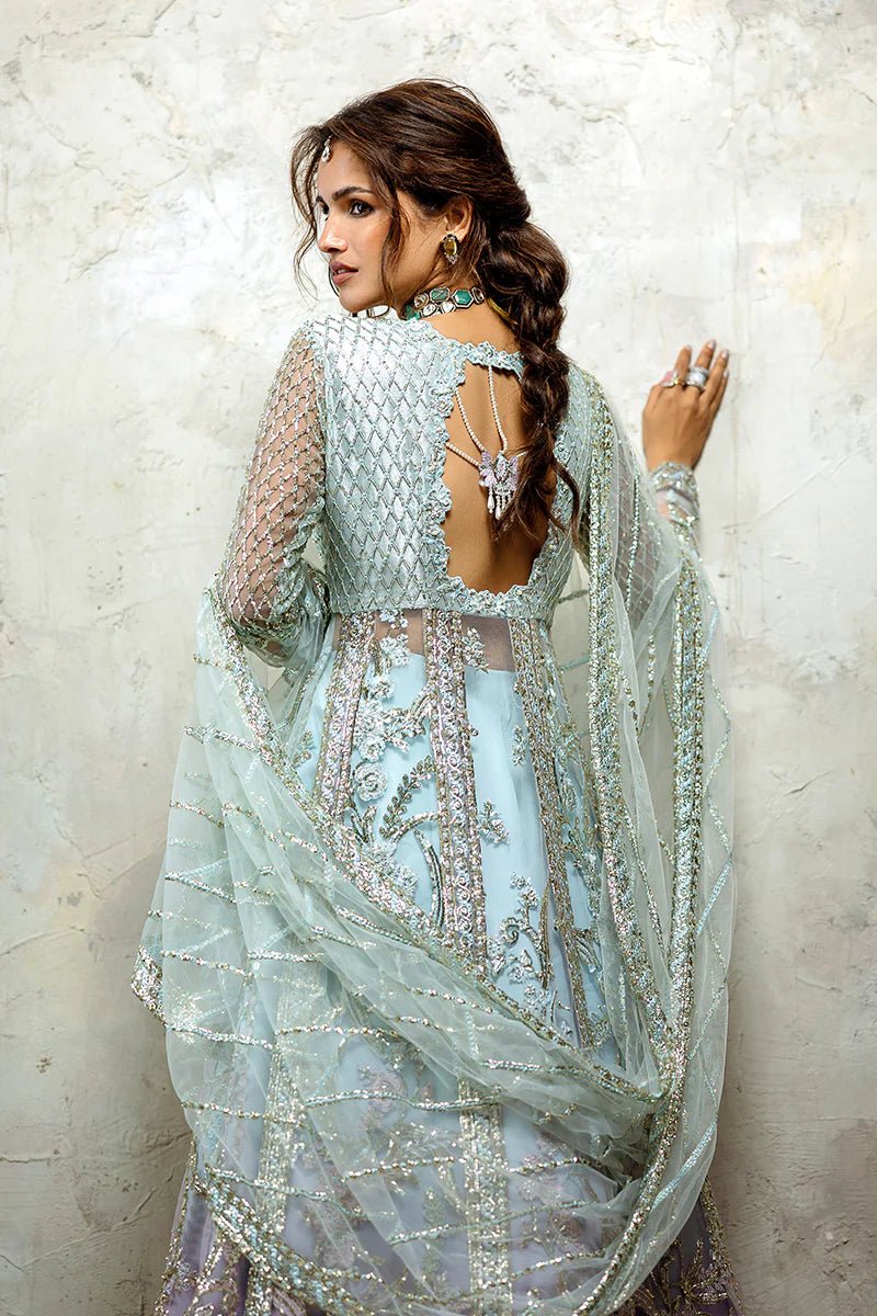 Model wearing Silver Screen from Mushq's Stardust Wedding Collection '24, featuring intricate details and elegant design. Pakistani clothes online in UK.