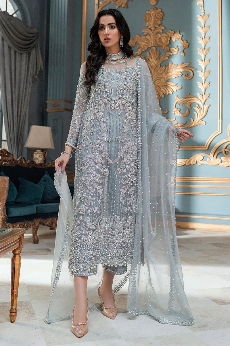 Model wearing Mushq's Adela dress in light blue, epitomizing elegant Pakistani wedding suit in the UK.