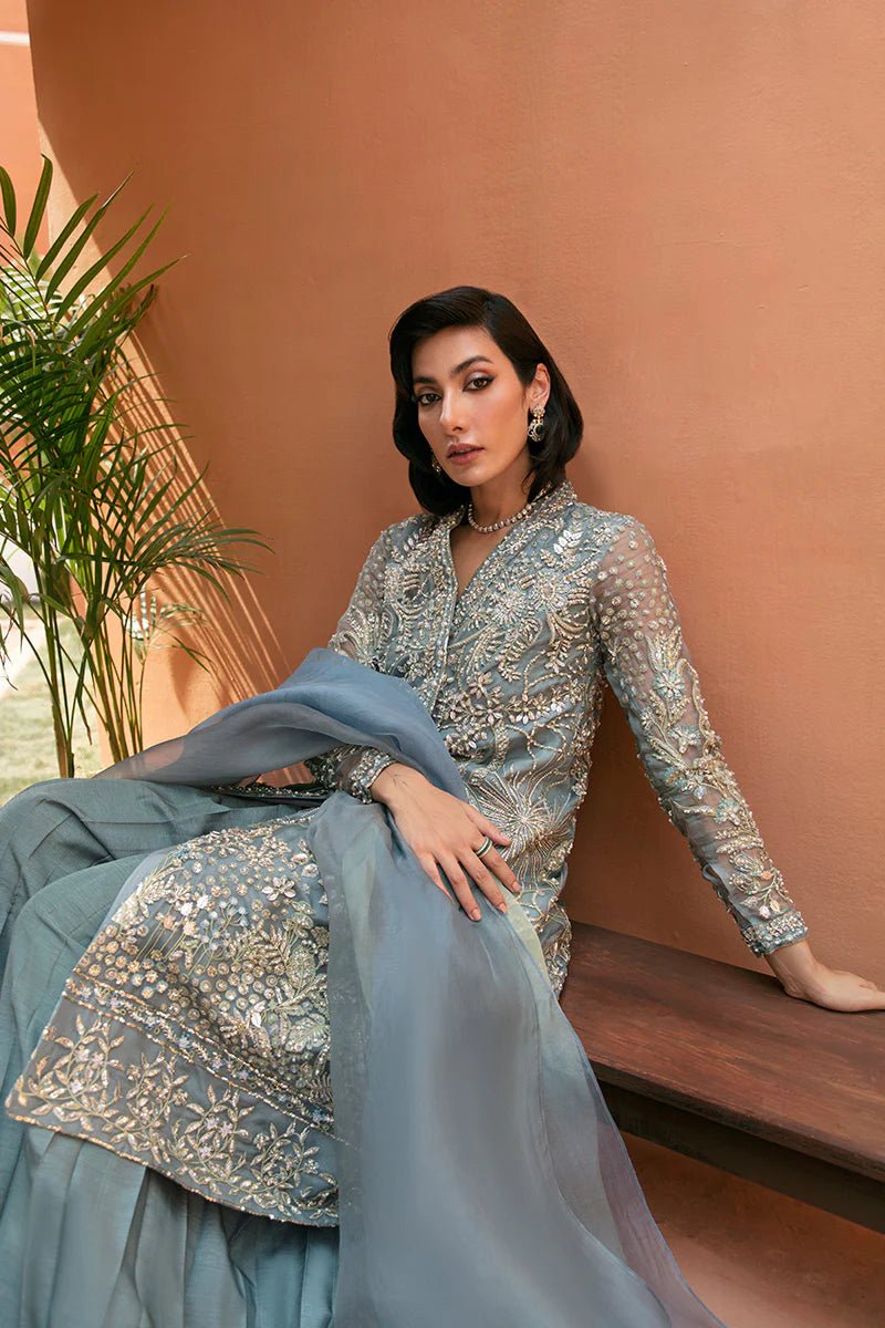 Model wearing Amora dress from Mushq's Tuscany Luxury Formals collection. Elegant Pakistani clothes online in UK at Signature Labels.