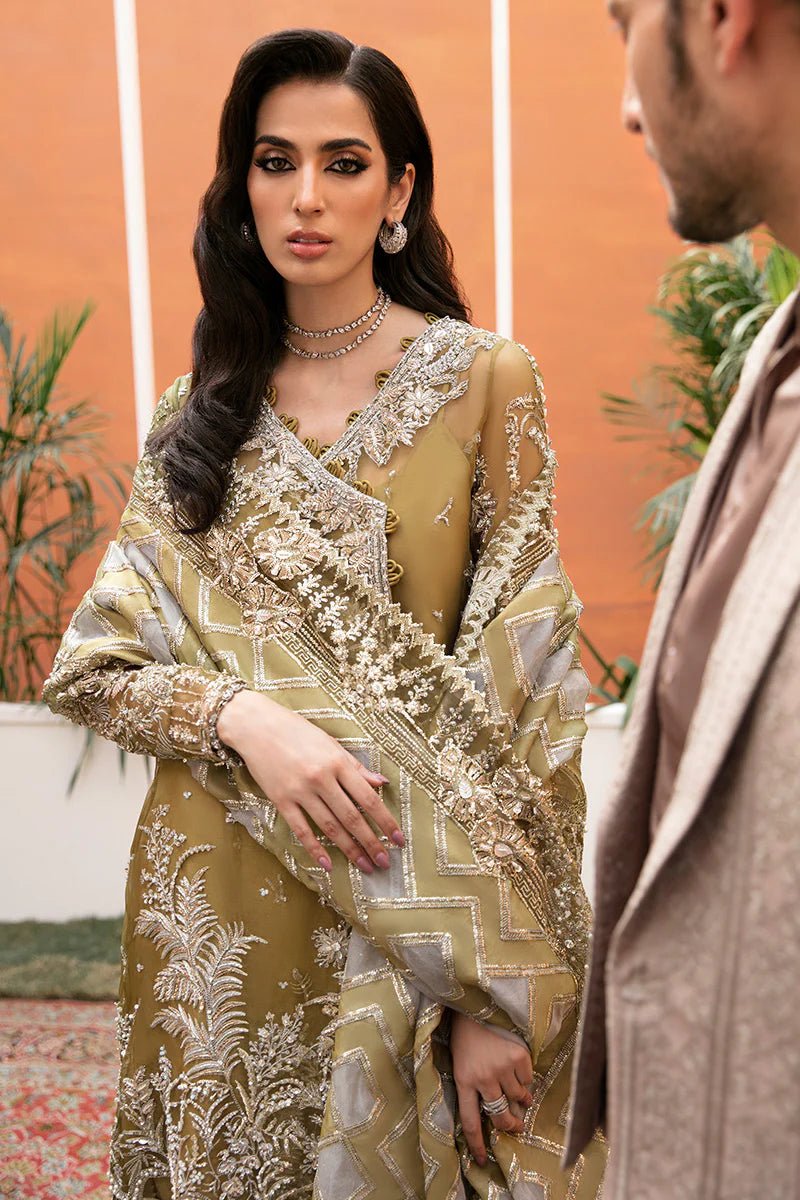 Model wearing Bosco dress from Mushq's Tuscany Luxury Formals. Pakistani clothes online in the UK at Signature Labels.