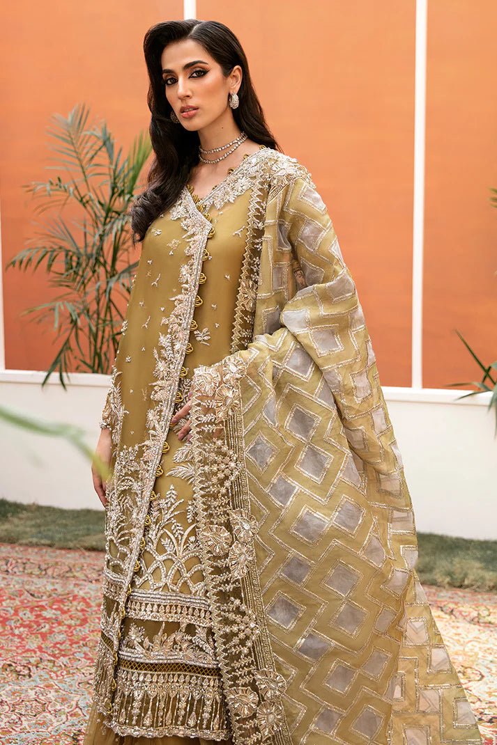 Model wearing Bosco dress from Mushq's Tuscany Luxury Formals. Pakistani clothes online in the UK at Signature Labels.