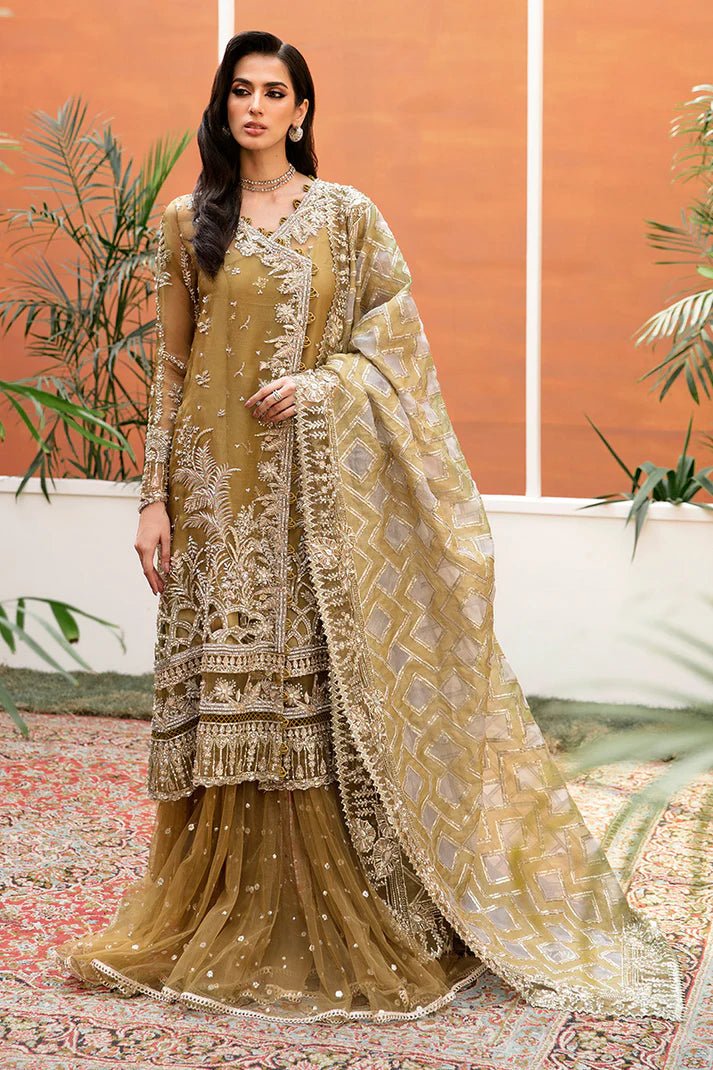 Model wearing Mushq's Bosco dress in olive green, epitomizing luxury Pakistani wedding attire in the UK.