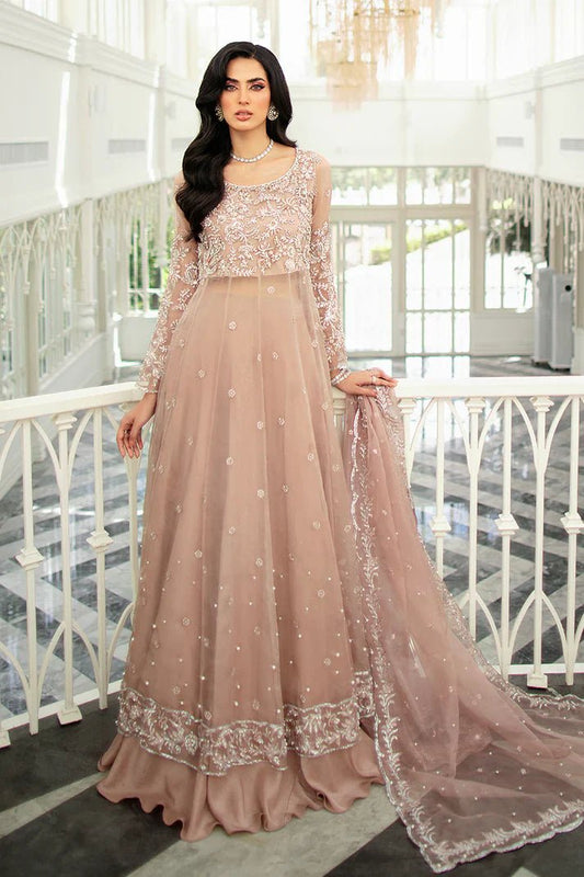 Model wearing Mushq's Celine dress in soft pink, epitomizing elegant Pakistani wedding attire in the UK.