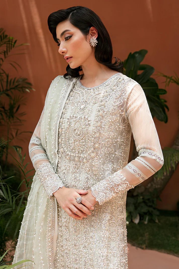 Model wearing Chiara dress from Mushq's Tuscany Luxury Formals. Pakistani clothes online in UK at Signature Labels.