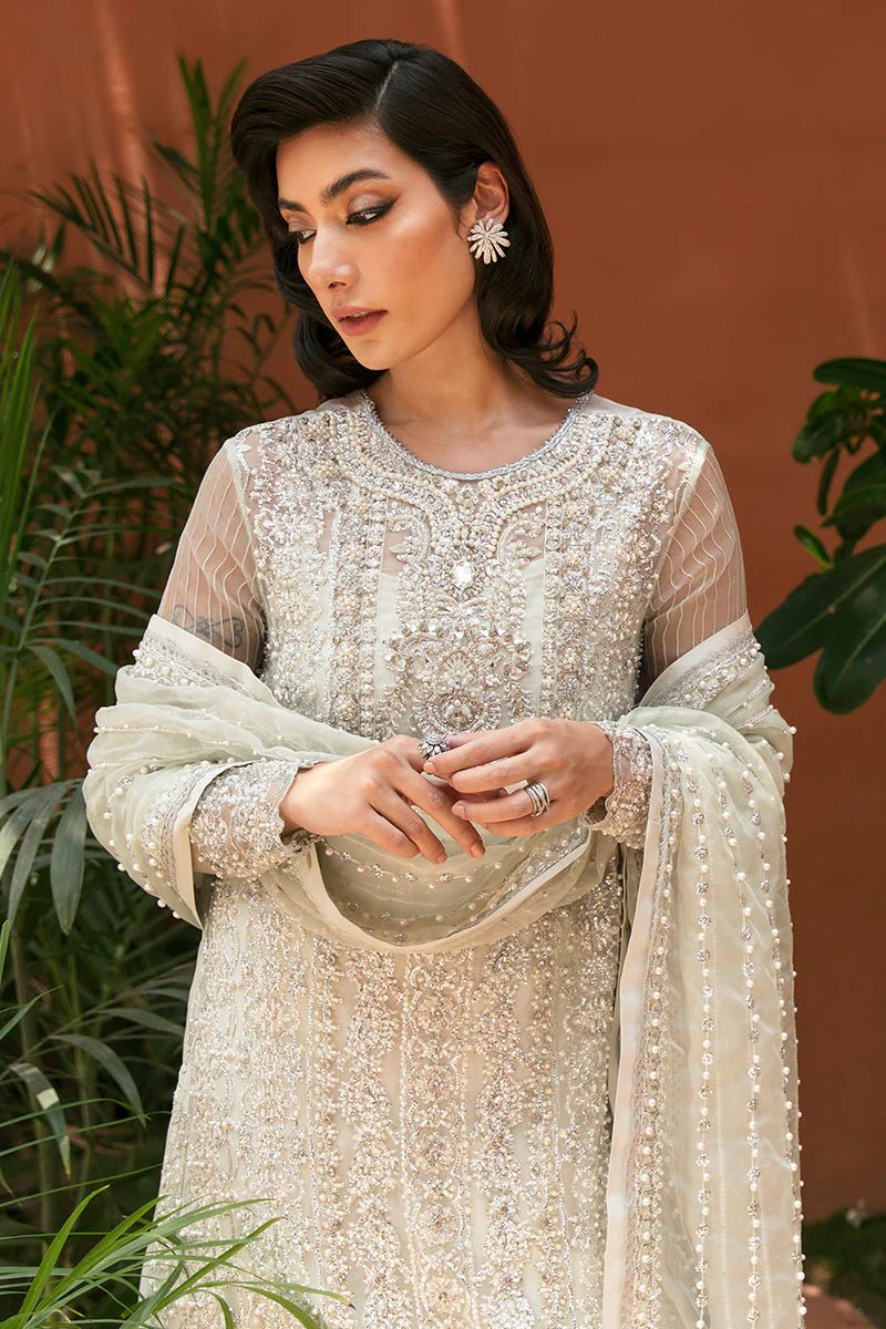 Model wearing Chiara dress from Mushq's Tuscany Luxury Formals. Pakistani clothes online in UK at Signature Labels.