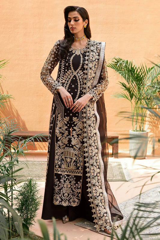 Model wearing Mushq's Eleonora dress in black, showcasing Pakistani wedding attire in the UK.