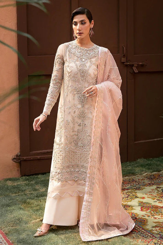 Model wearing Mushq's Fiorella dress in blush pink, symbolizing sophisticated Pakistani wedding attire in the UK.