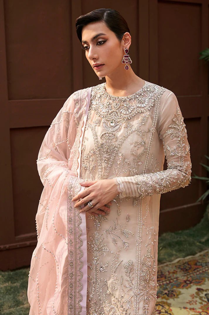 Model wearing Fiorella dress from Mushq's Tuscany Luxury Formals collection. Pakistani clothes online in UK at Signature Labels.