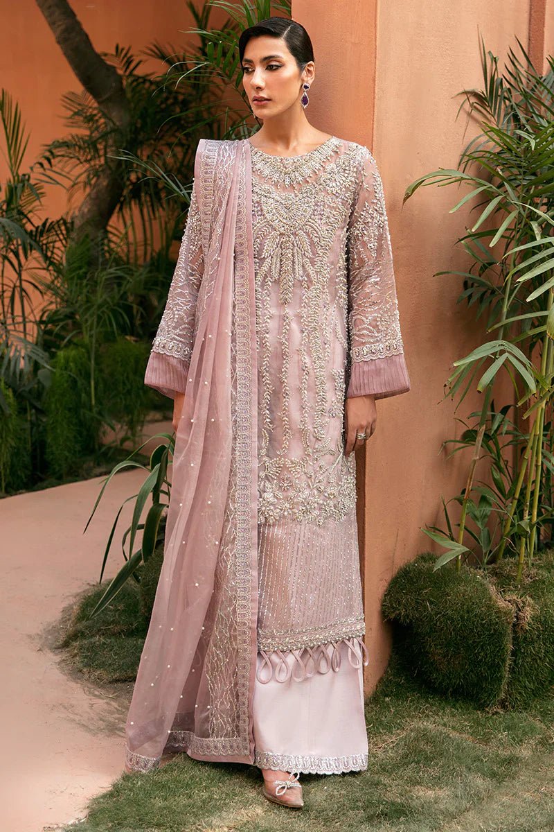 Model wearing Mushq's Melissa dress in light mauve with intricate silver embroidery, ideal for showcasing Pakistani designer wedding clothes in the UK.