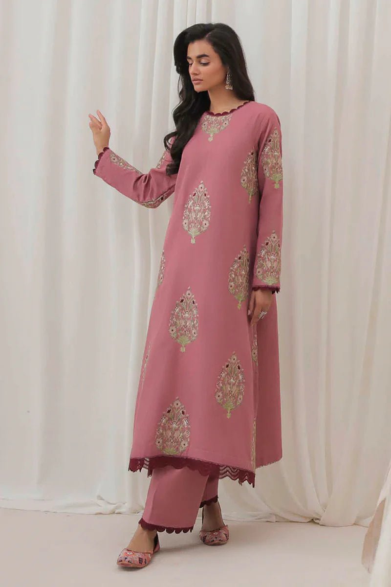 Model wearing Mushq Wisteria Winter Basic Pret '24 Polar Vogue, a rose pink dress with intricate embroidery, ideal for winter casual wear. Available for Pakistani clothes online in the UK.