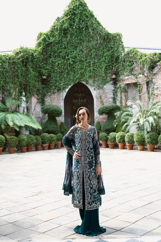 Model wearing Mysie by Tahira AROOB dress in teal, showcasing intricate embroidery and elegant design, perfect for weddings. showcasing Pakistani clothes online in the UK at Signature Labels