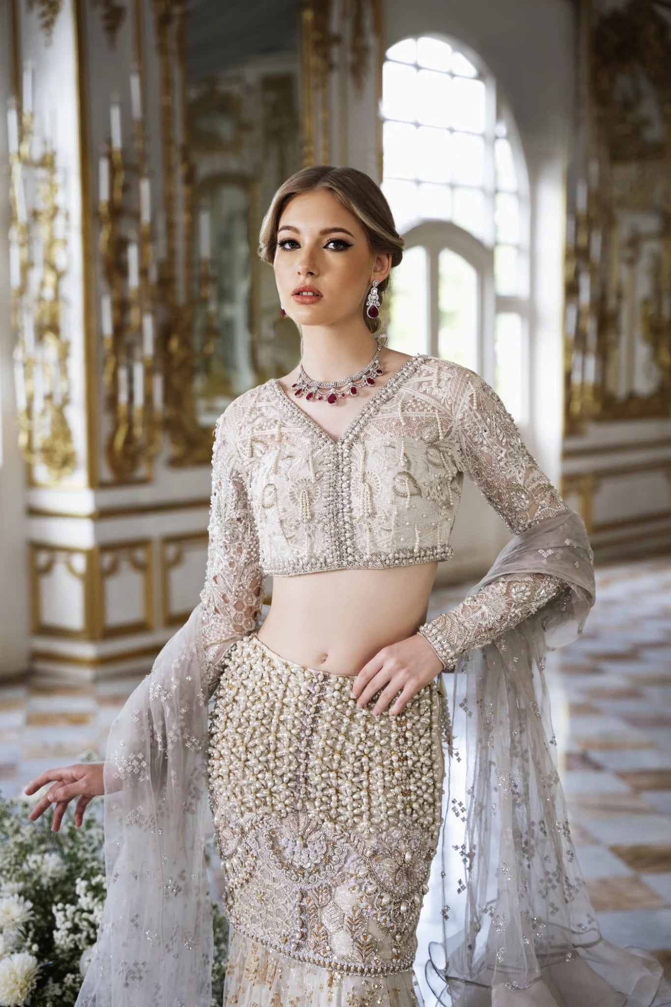 Model wearing a cream DONNA dress with intricate embroidery and beading from Mysie by Tahira. Perfect for weddings, available in the UK.