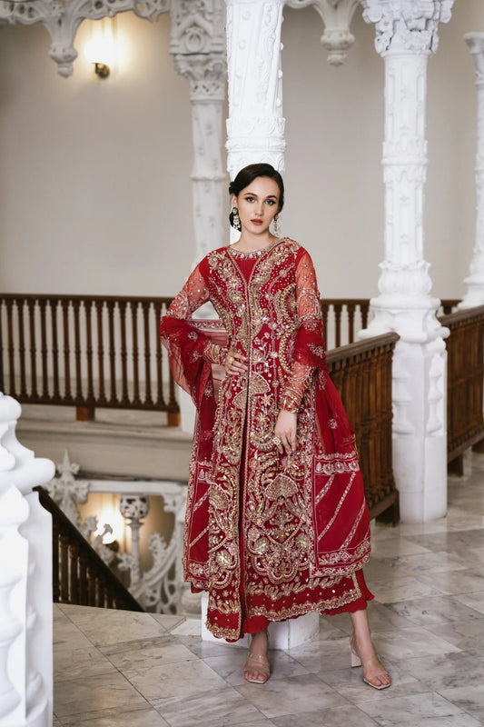 Model wearing a red embellished HAZE dress from Mysie by Tahira. The dress features intricate gold embroidery and sequins, perfect for wedding clothes