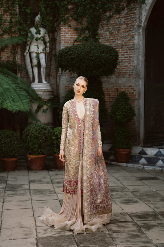 Model wearing a multicolored SHABANA dress with intricate embroidery, featuring shades of beige and red, from Mysie by Tahira. Perfect for Pakistani wedding clothes online in the UK.