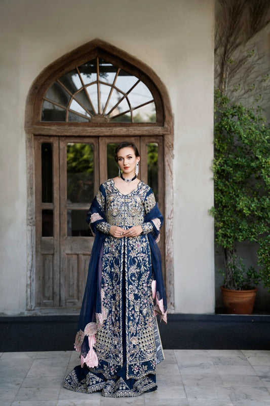 Model wearing a navy blue embroidered SIAMESE dress from Mysie by Tahira. Perfect for weddings. Pakistani clothes online in UK.