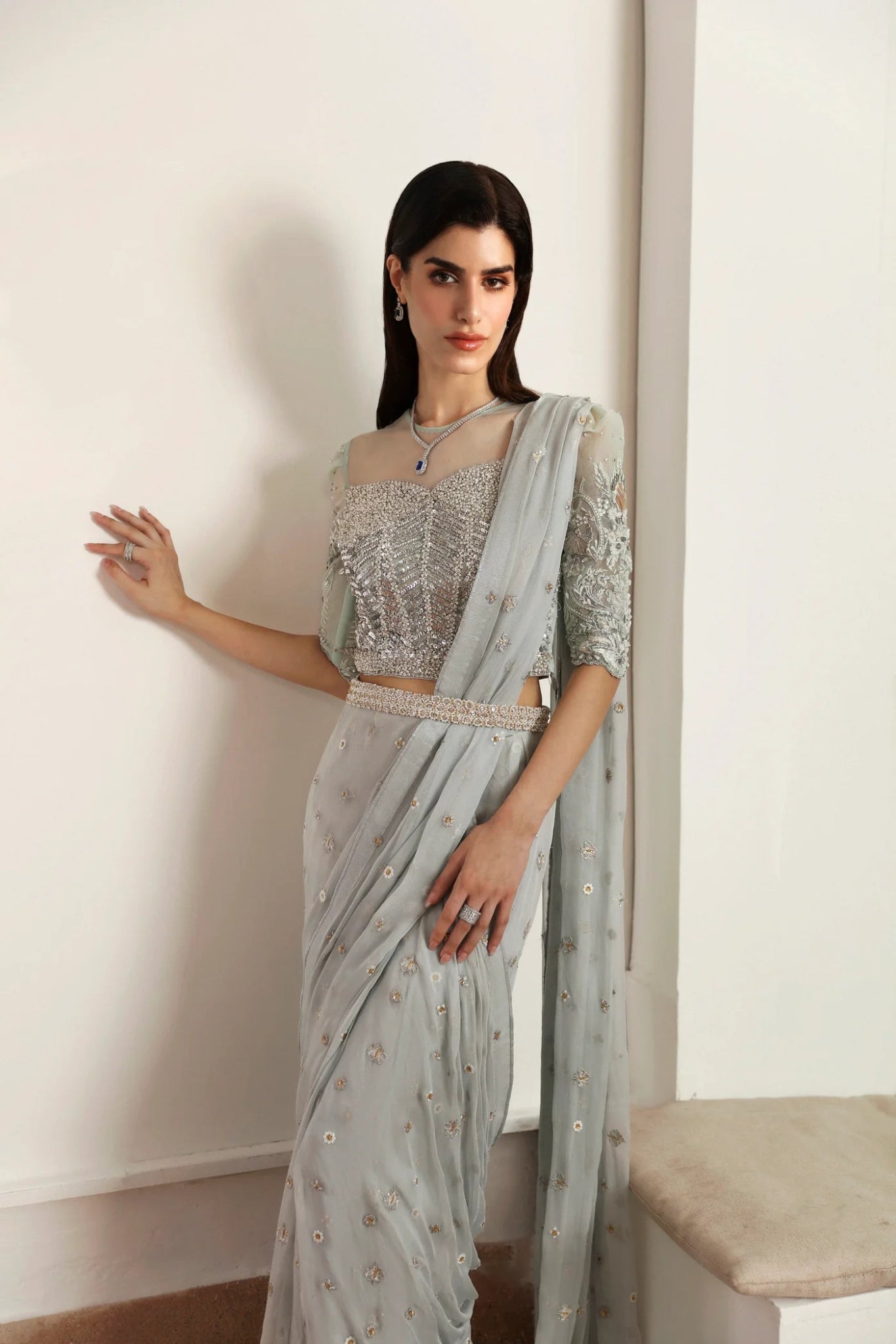 Model wearing Hafsa from Mysie by Tahira in a silver - grey embellished saree. Pakistani clothes online in UK, ideal for weddings and formal events.