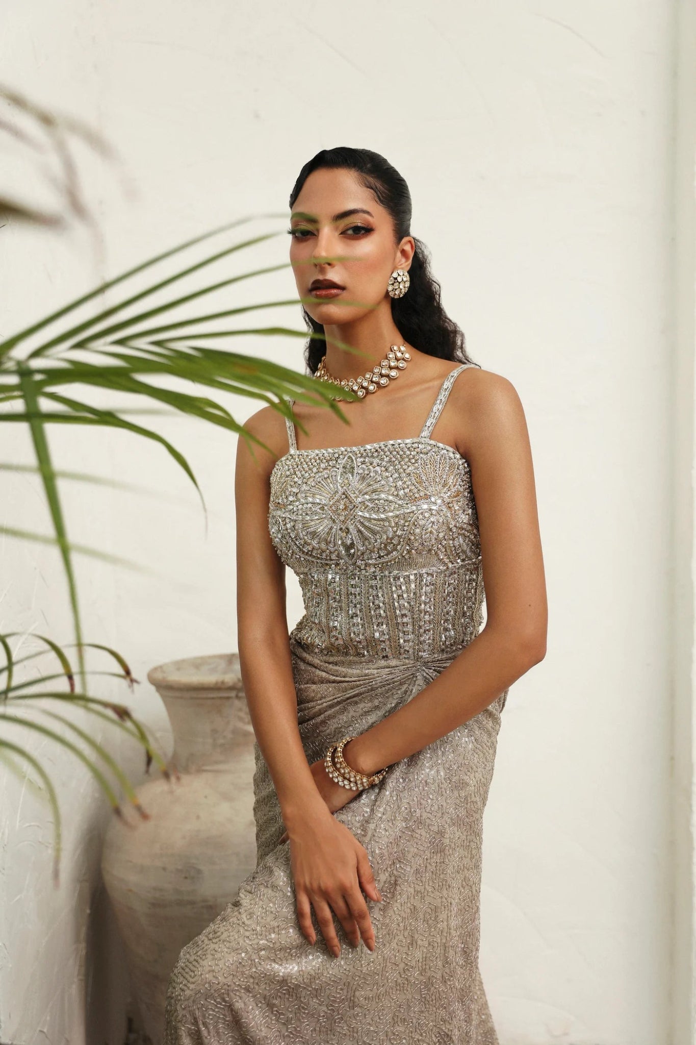 Model wearing Melody from Mysie by Tahira in a silver - beige embellished gown. Pakistani clothes online in UK, perfect for weddings and formal events.