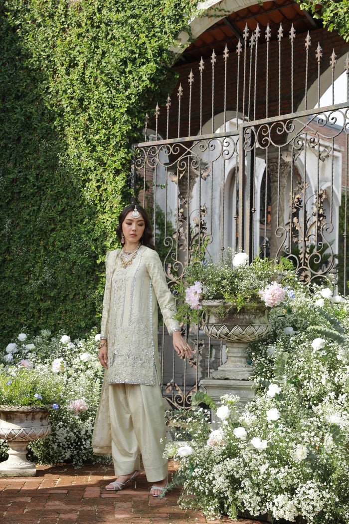 Model wearing Pherah from Mysie by Tahira's Arzu Bridals '24 collection in elegant gold. Wedding wear, bridal, Pakistani clothes online in UK.