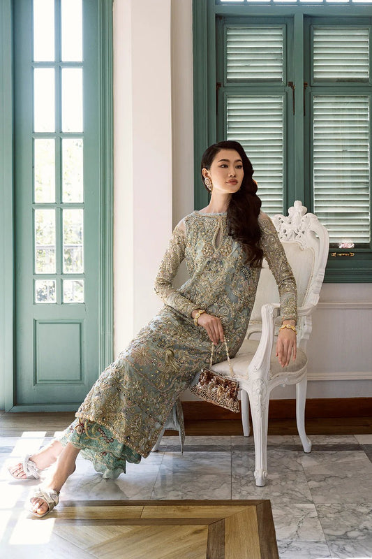 Model wearing Amriti dress from Mysie by Tahira Eid Pret '24, epitomizing Pakistani fashion in the UK.