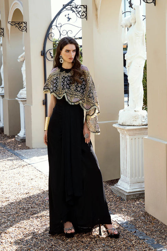 Model in black Crystal dress from Mysie by Tahira Eid Pret '24, blending opulence with Pakistani style in the UK.